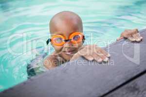 Little boy smiling in the pool