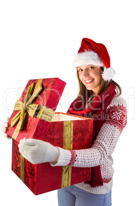 Festive brunette opening a gift