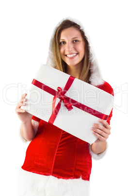 Pretty santa girl holding gift