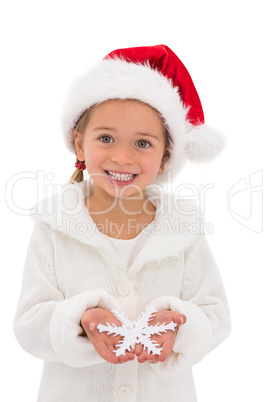 Festive little girl holding snowflake