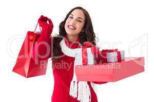 Happy brunette holding christmas gifts