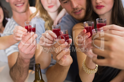 Happy friends having a drink together