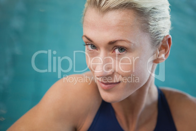 Close-up portrait of a female swimmer by pool