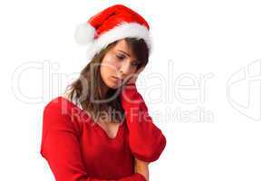 Sad woman in santa hat holding her head