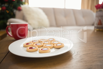 Cookies and mug on coffee table at christmas