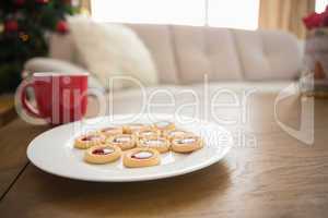 Cookies and mug on coffee table at christmas