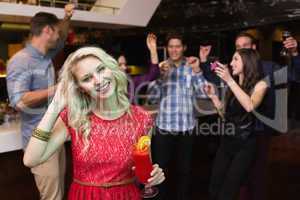 Pretty blonde drinking a cocktail