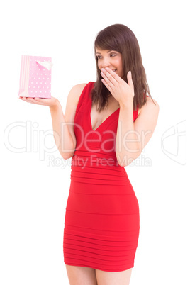 Festive brunette holding a gift bag