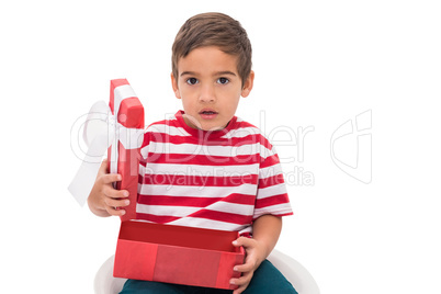 Cute little boy opening gift