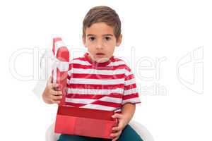 Cute little boy opening gift