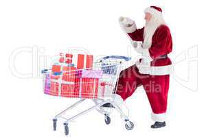 Santa pushes a shopping cart while reading