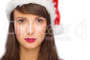 Portrait of serious pretty young woman in santa costume