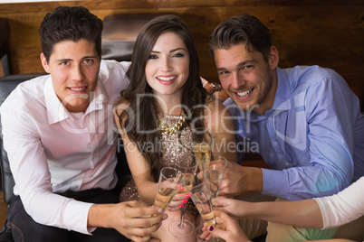 Stylish friends having a drink together