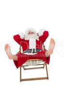 Relaxed santa stiting on deckchair