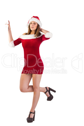 Pretty santa girl posing with hand