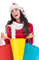Festive brunette opening shopping bag