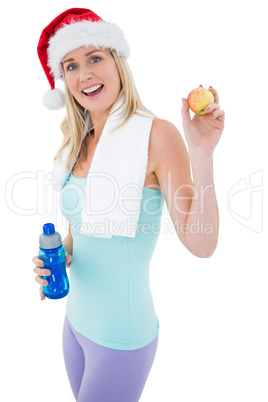 Festive fit blonde smiling at camera