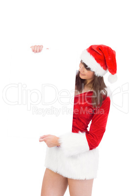 Pretty santa girl holding poster