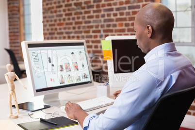 Businessman looking at computer monitor