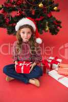 Festive little girl holding gift