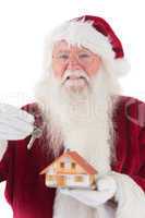 Santa hands the key to a tiny house