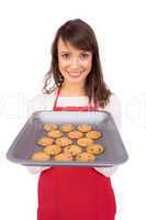 Festive brunette offering hot cookies
