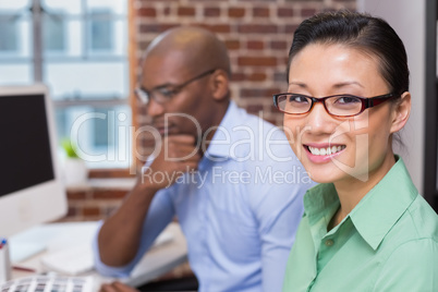 Smiling female photo editor in office