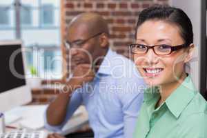 Smiling female photo editor in office