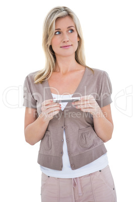 Happy blonde holding her phone