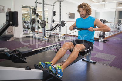 Man using resistance band in gym