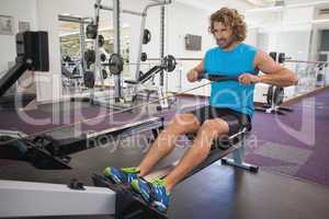 Man using resistance band in gym