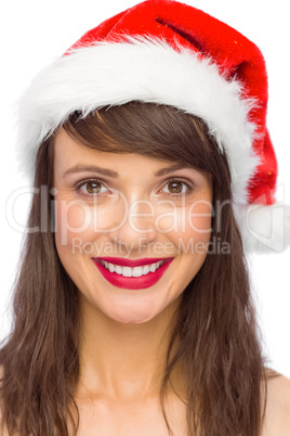 Portrait of pretty young woman in santa costume smiling