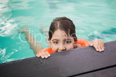 Little boy smiling in the pool