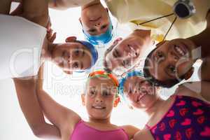 Swimming coach with his students poolside