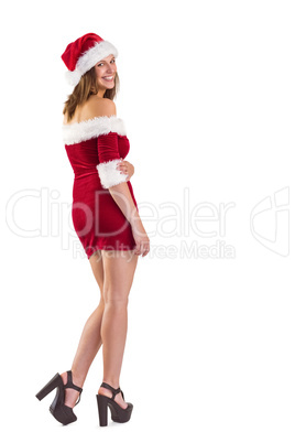 Pretty girl in santa outfit smiling at camera