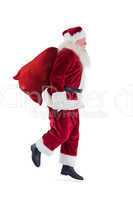 Santa jumps with his bag