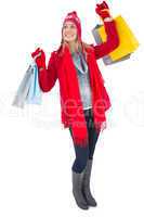 Blonde in winter clothes holding shopping bags