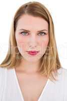 Portrait of a serious blonde woman looking at camera