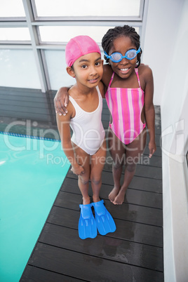 Cute little kids standing poolside