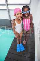 Cute little kids standing poolside