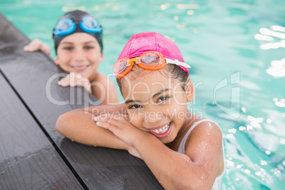 Cute swimming class in the pool