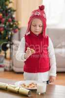 Festive little boy holding a cookie