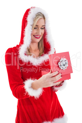 Festive blonde opening a gift