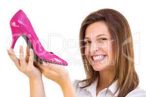 Elegant brunette admiring a shoe
