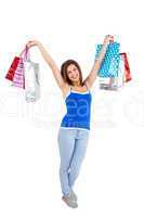 Festive young woman holding shopping bags