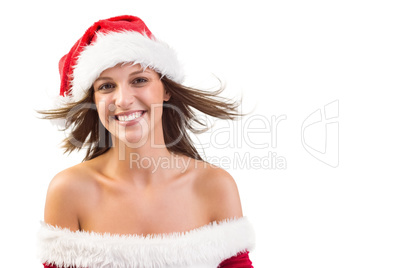 Woman in santa hat with hair in the wind