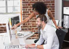 Photo editors using computer in office