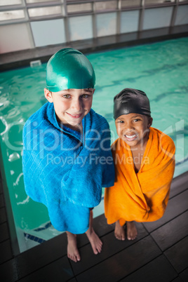 Little boys smiling by the pool
