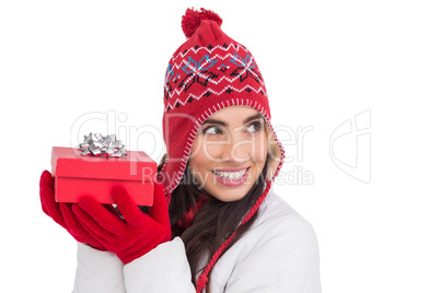 Happy brown hair holding red gift