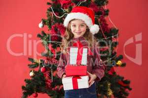 Festive little girl holding gifts